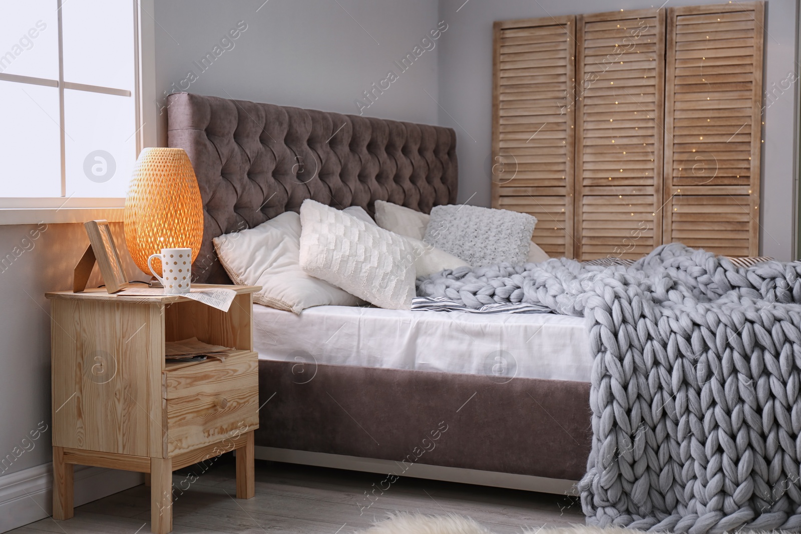 Photo of Stylish bedroom interior with comfortable bed