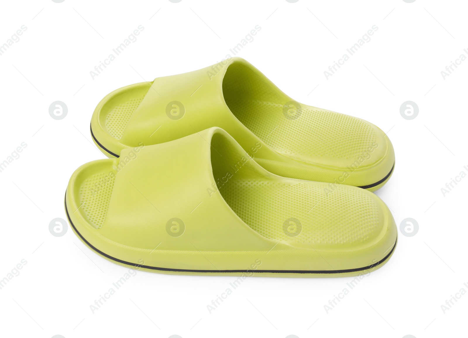 Photo of Pair of green rubber slippers isolated on white