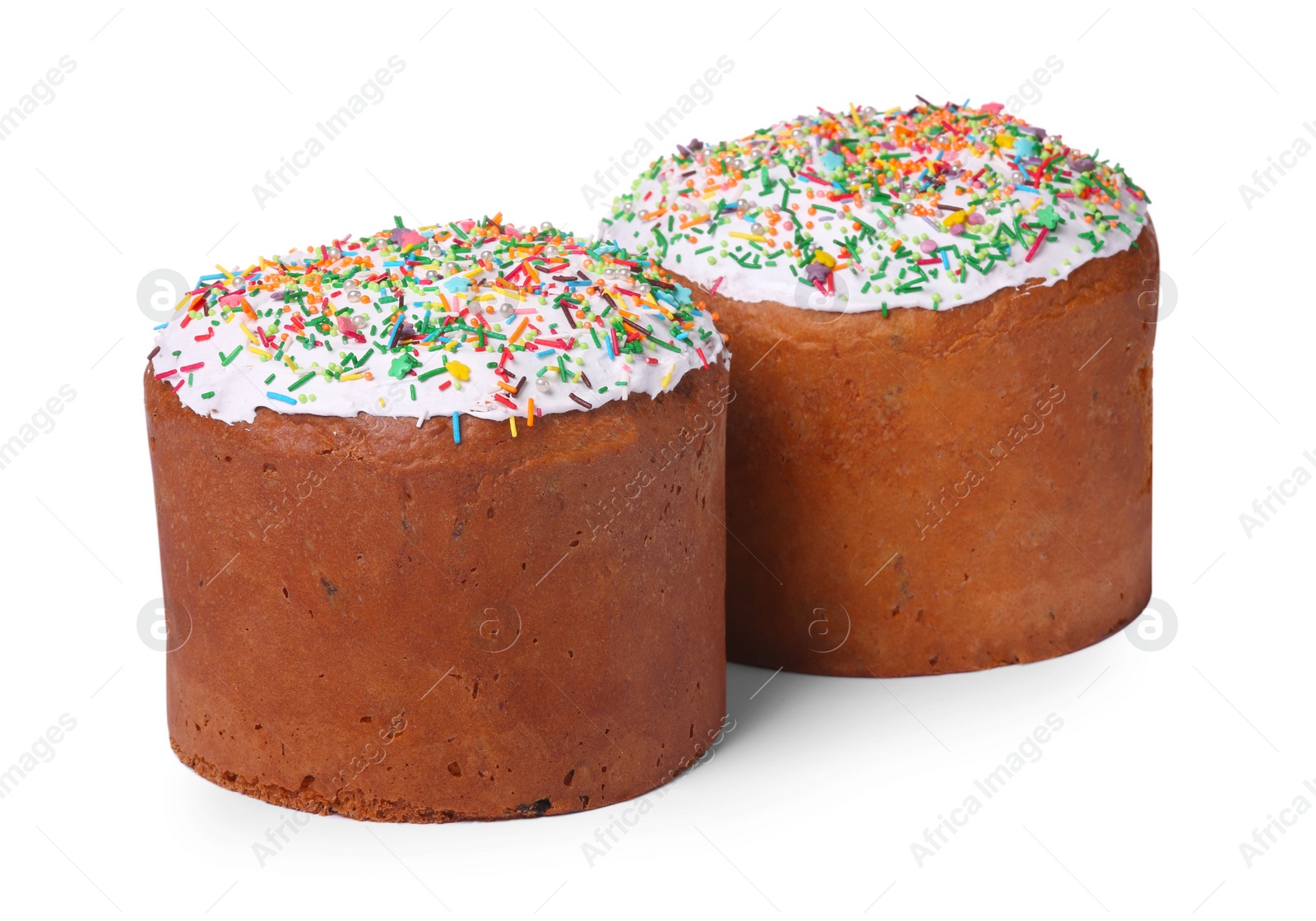 Photo of Traditional Easter cakes with sprinkles isolated on white