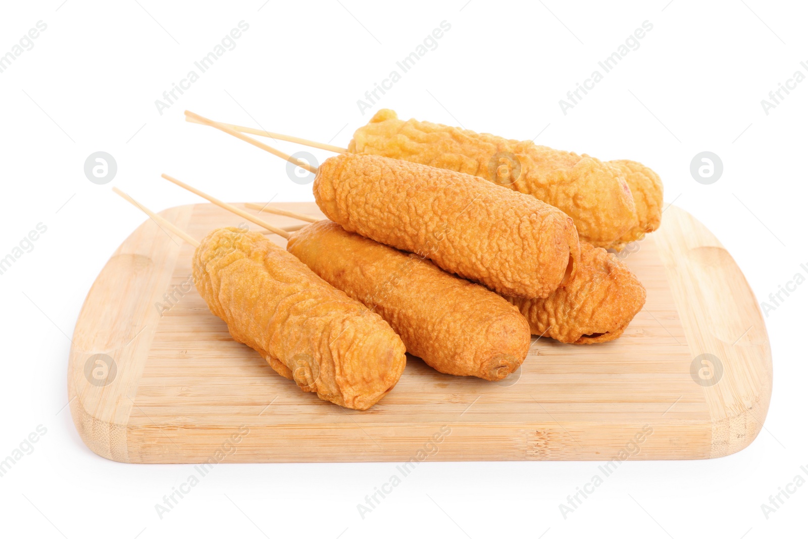 Photo of Delicious deep fried corn dogs with wooden board isolated on white