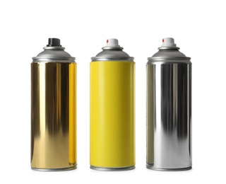 Photo of Cans of different spray paints on white background