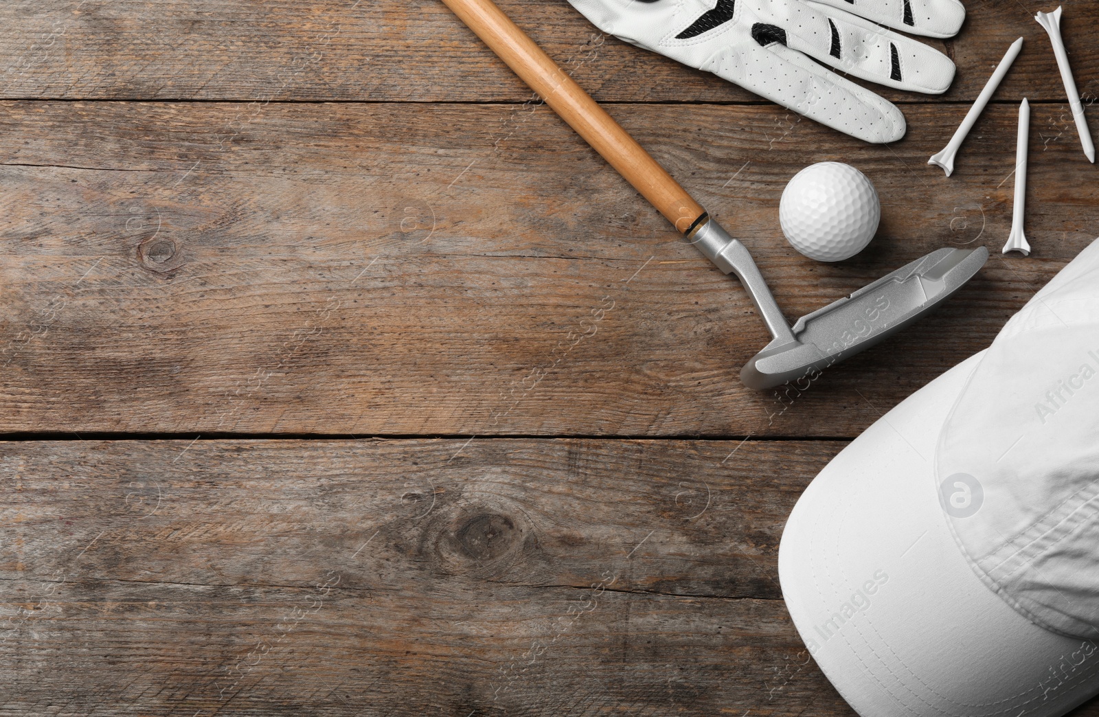 Photo of Flat lay composition with golf accessories and space for text on wooden background