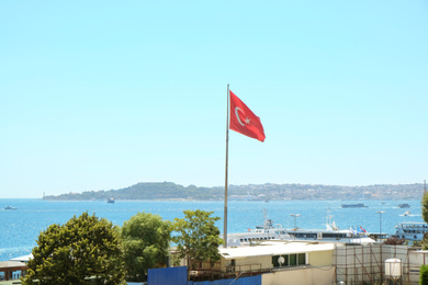 Photo of ISTANBUL, TURKEY - JULY 29, 2019: Turkish flag in hotel at Bosphorus