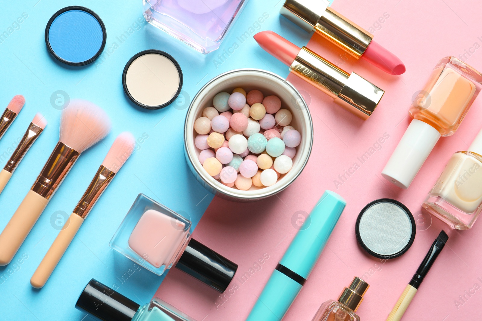 Photo of Flat lay composition with decorative cosmetics on color background