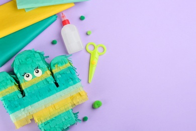 Photo of Flat lay composition with cardboard cactus on violet background, space for text. Pinata diy