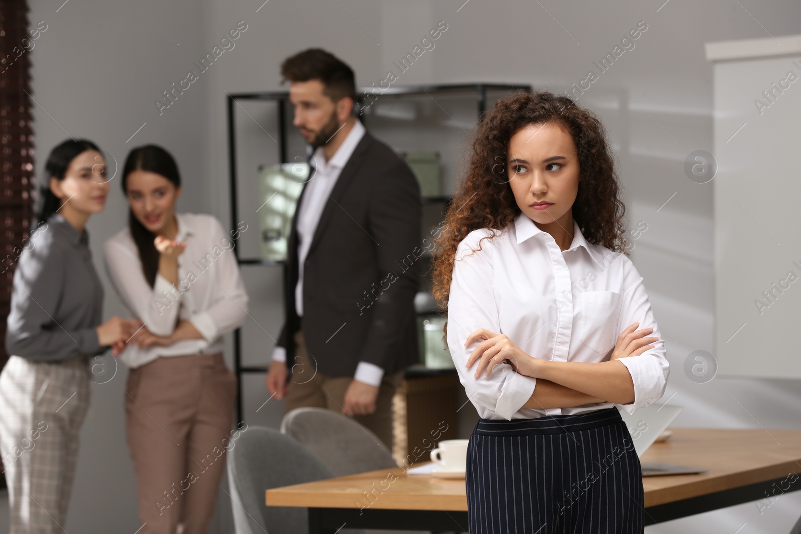 Photo of African American woman suffering from racial discrimination at work