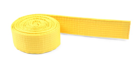 Photo of Yellow karate belt isolated on white. Martial arts uniform