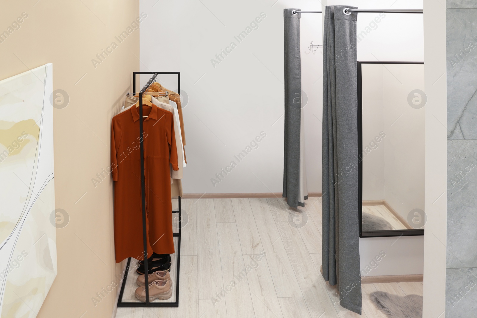 Photo of Dressing rooms in fashion store. Interior design