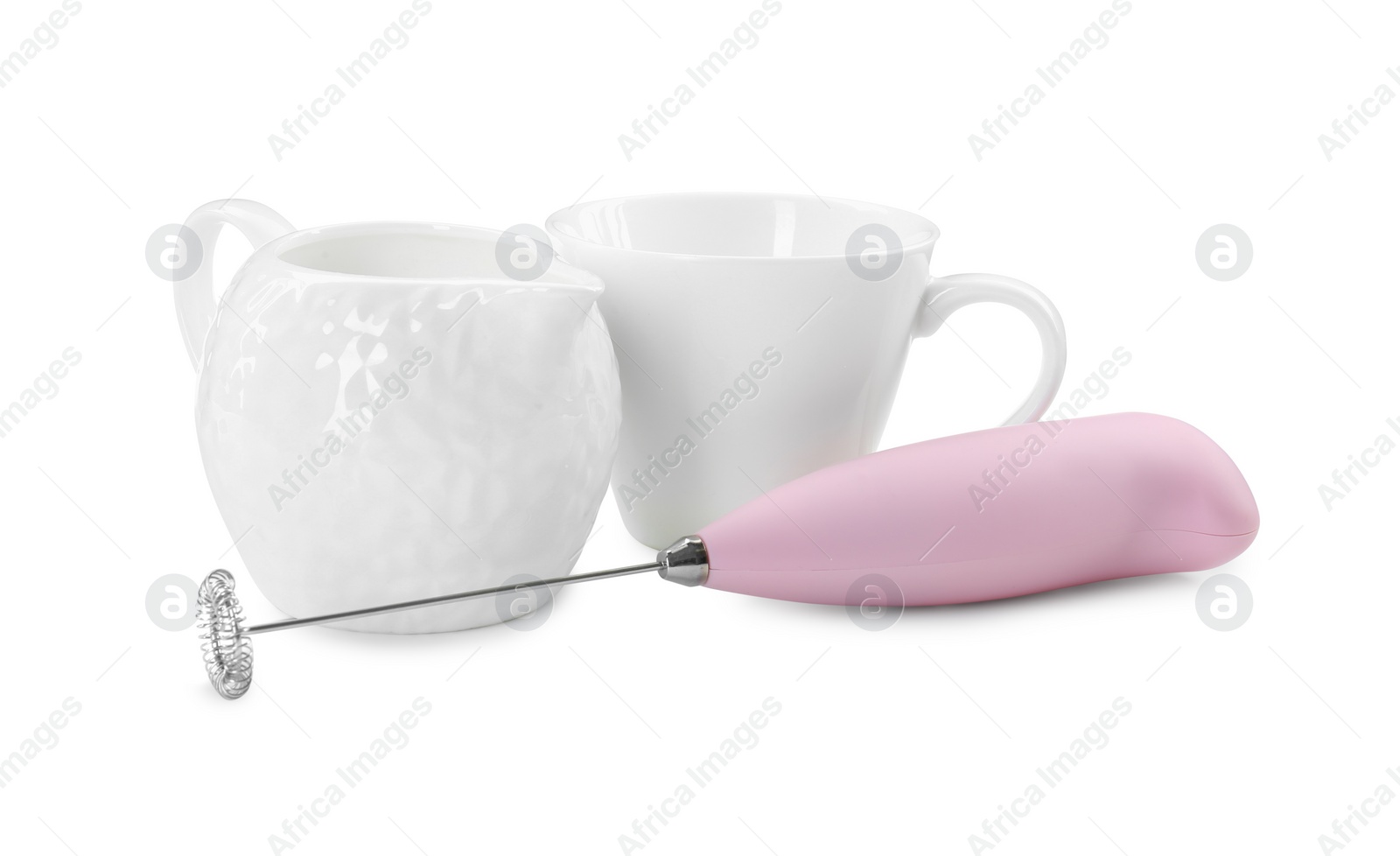 Photo of Milk frother wand, cup and pitcher isolated on white