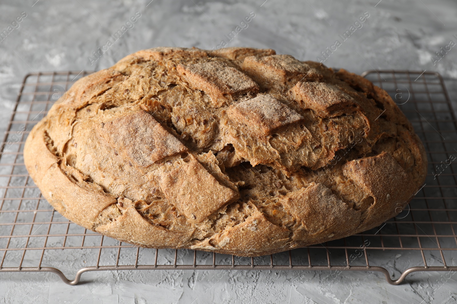 Photo of Freshly baked sourdough bread on grey table