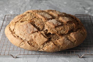 Photo of Freshly baked sourdough bread on grey table