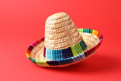 Photo of One Mexican sombrero hat on red background