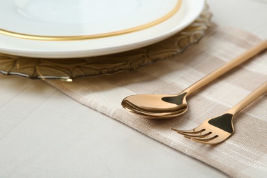 Photo of Beautiful table setting with gold cutlery on grey background