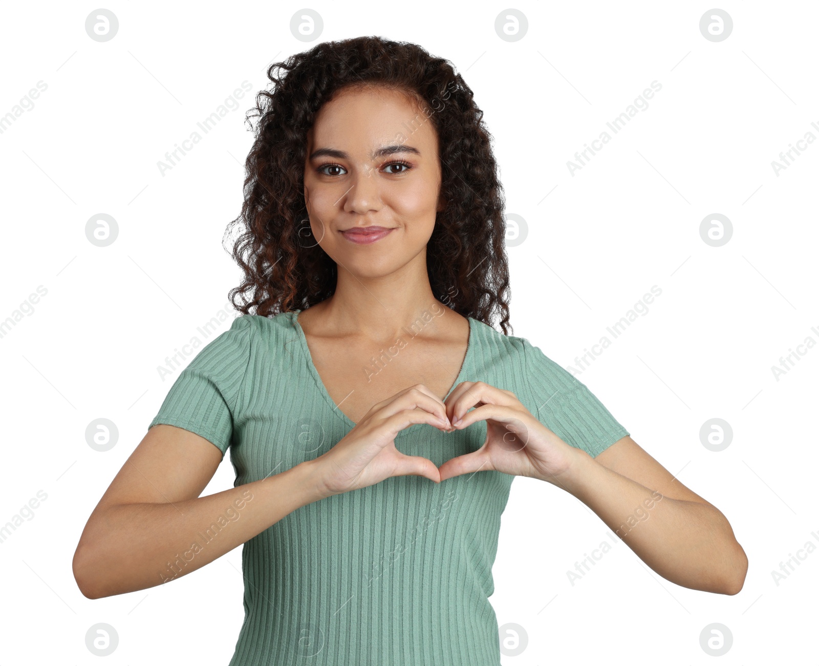 Photo of Happy young African-American woman making heart with hands on white background