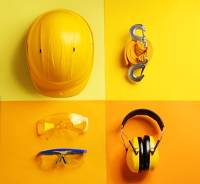 Flat lay composition with safety equipment on color background
