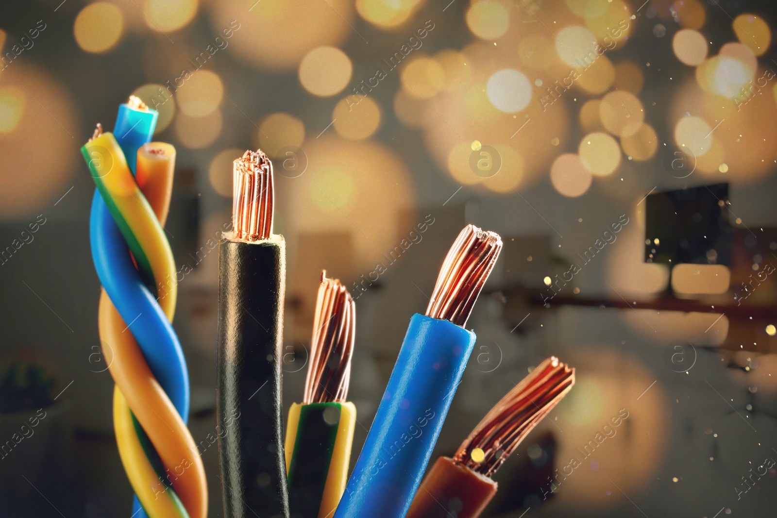 Image of Colorful electrical wires against blurred background, closeup. Bokeh effect