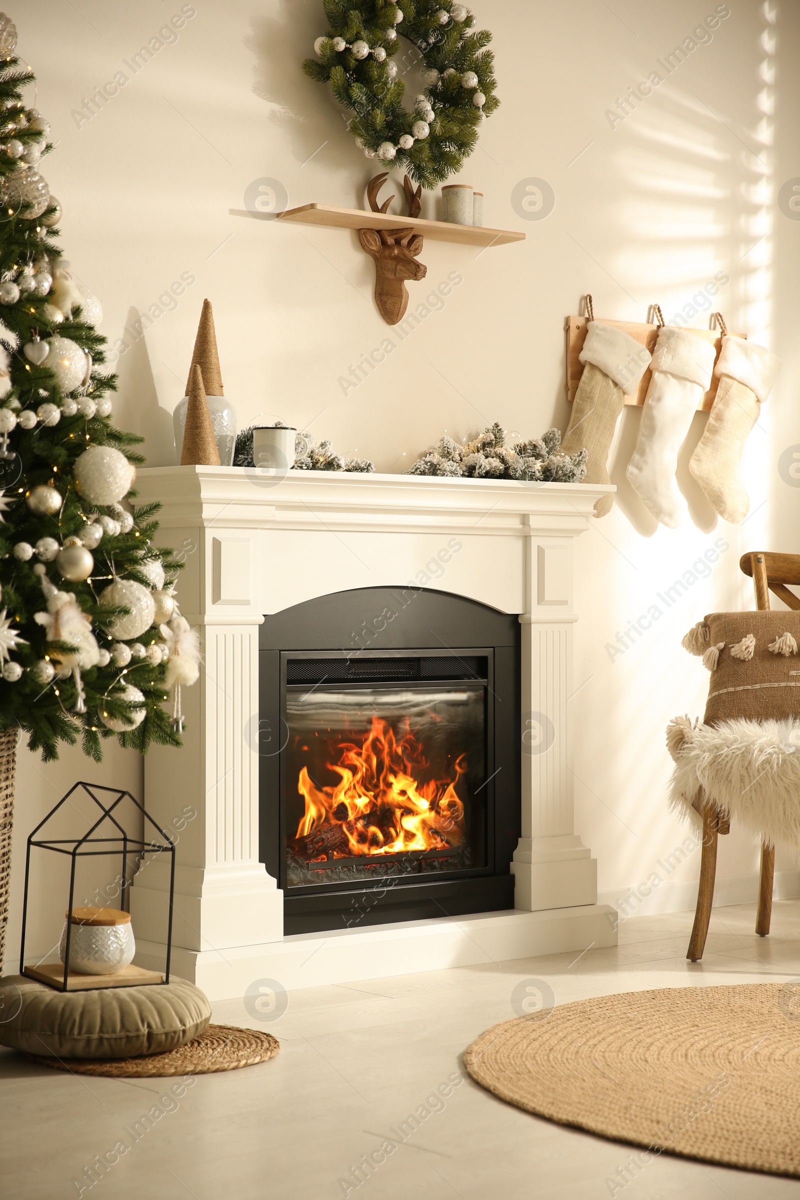 Photo of Modern fireplace in living room decorated for Christmas