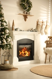 Photo of Modern fireplace in living room decorated for Christmas
