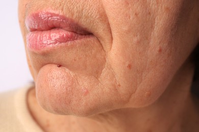 Skin care. Senior woman, closeup view of lips
