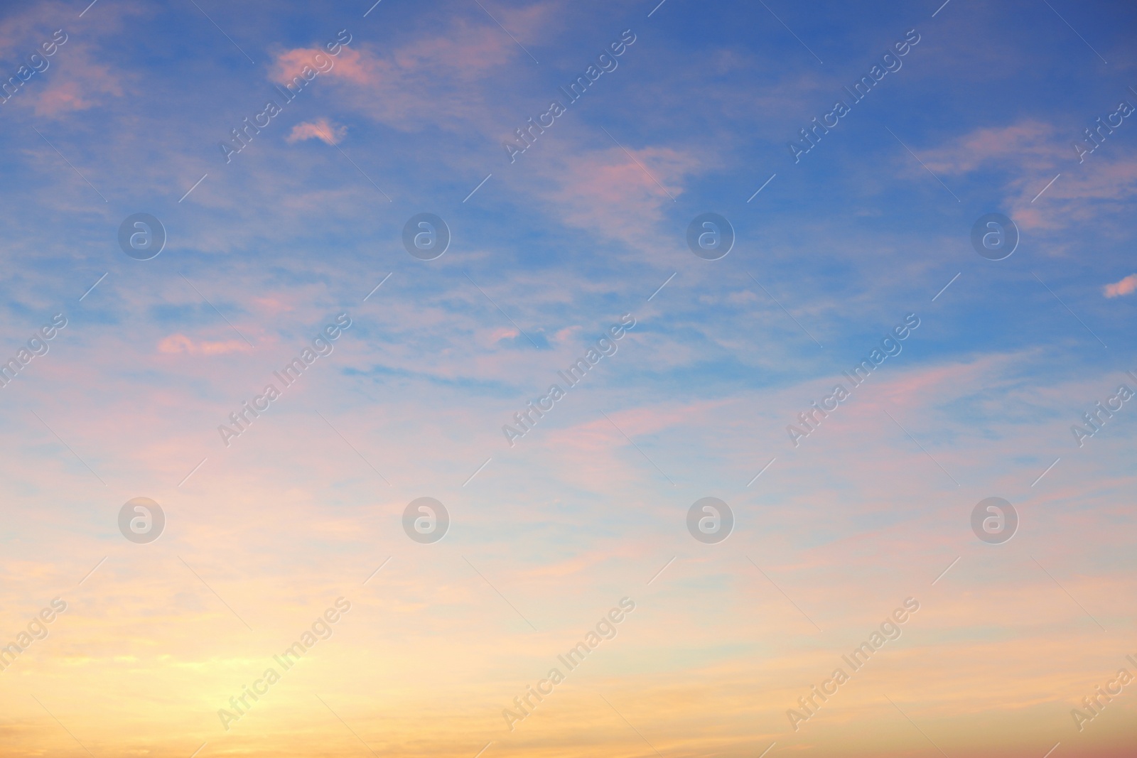 Photo of Picturesque view of beautiful sky lit by setting sun