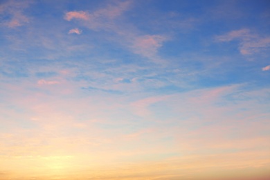 Photo of Picturesque view of beautiful sky lit by setting sun