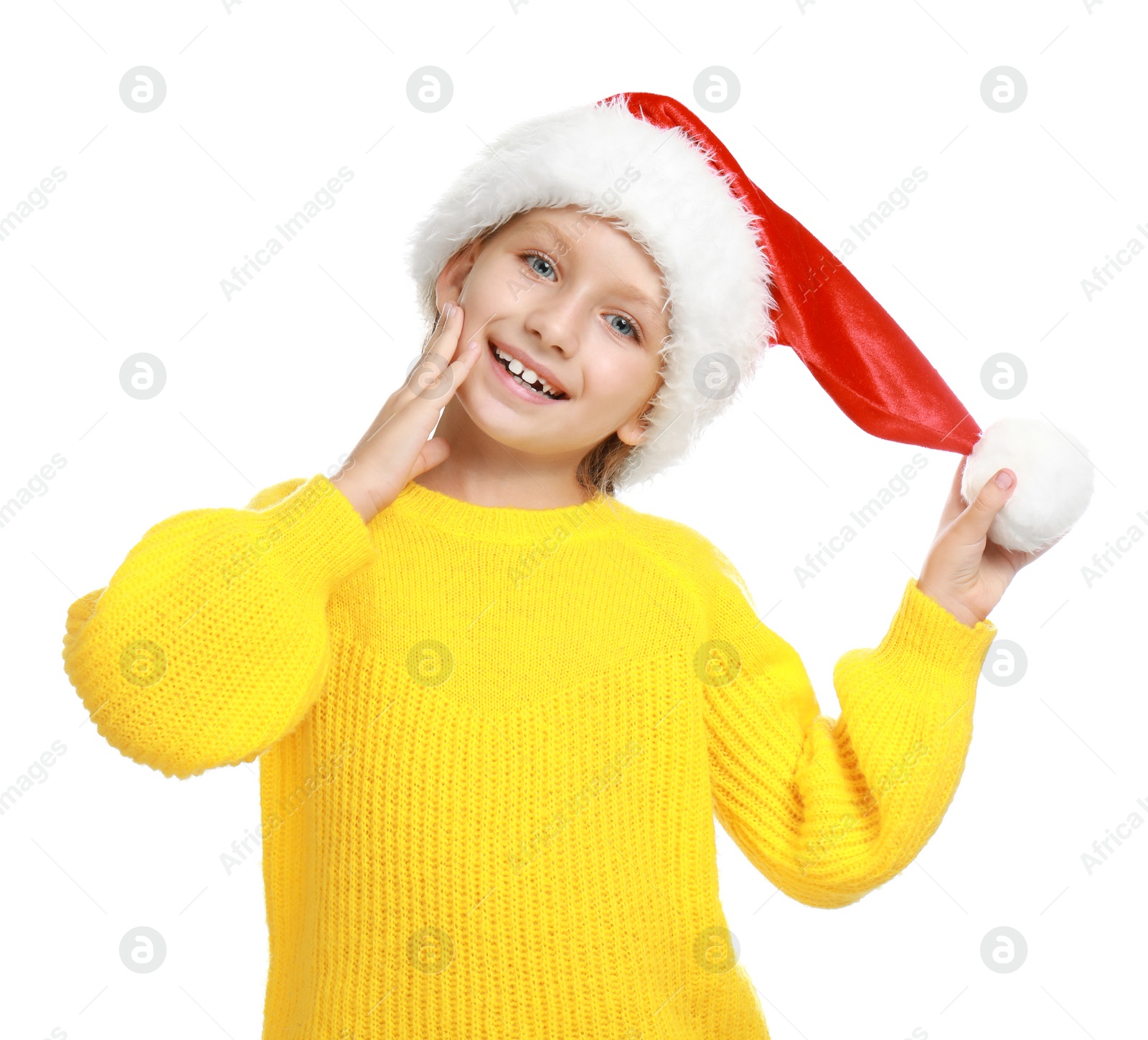Photo of Happy little child in Santa hat on white background. Christmas celebration