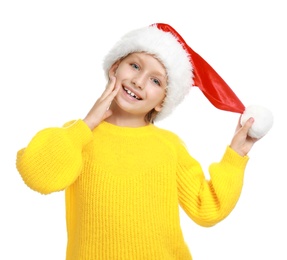 Happy little child in Santa hat on white background. Christmas celebration