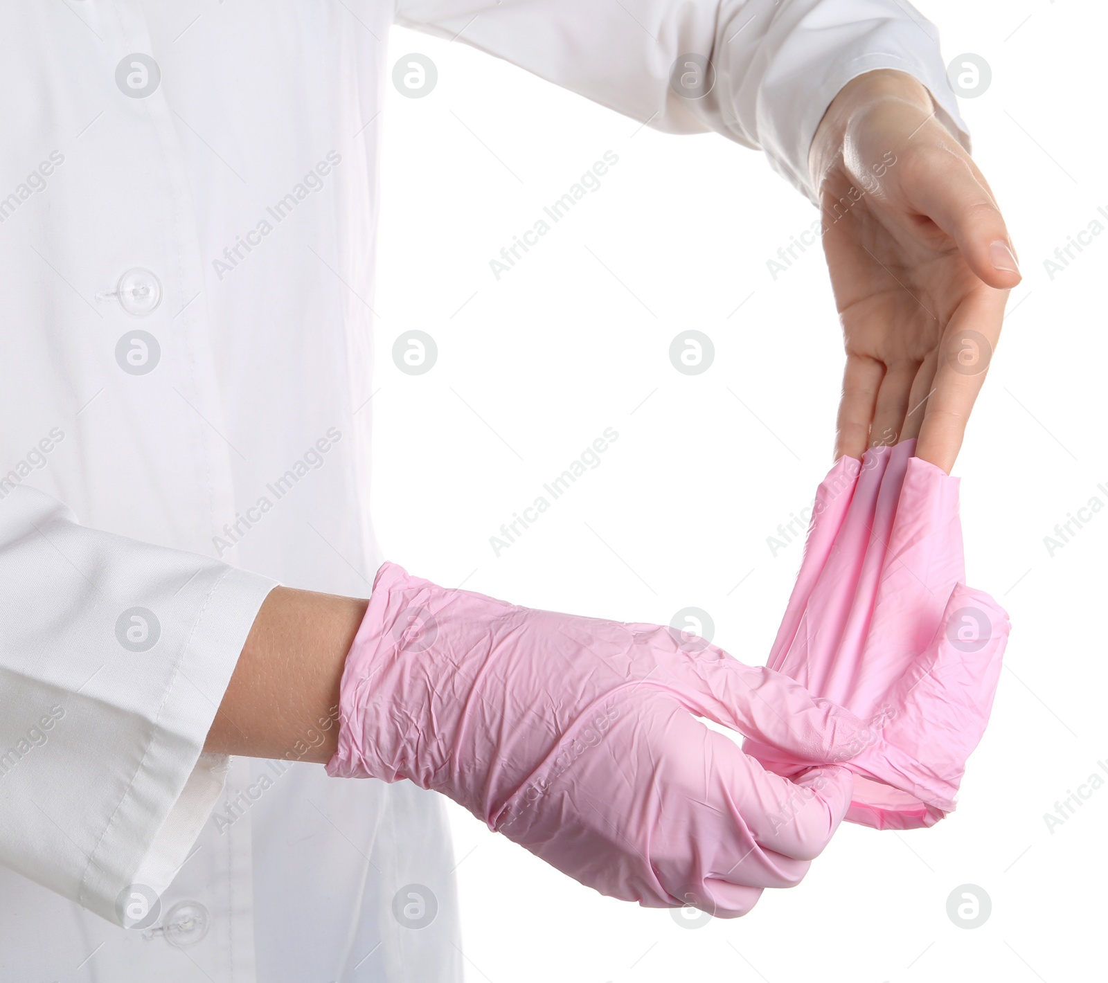 Photo of Doctor taking off medical gloves on white background