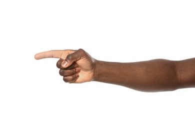 African-American man pointing at something on white background, closeup