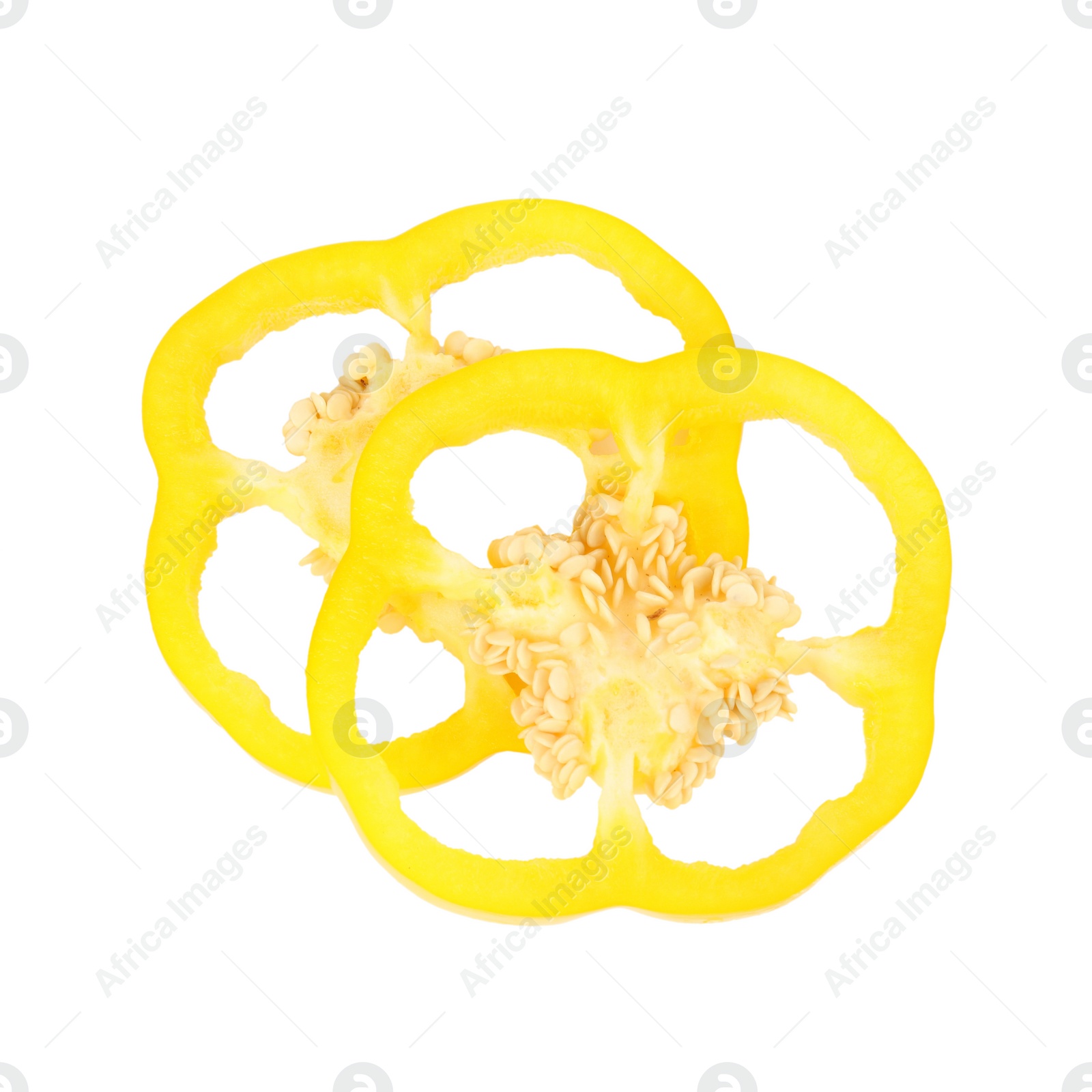 Photo of Slices of yellow bell pepper with seeds isolated on white, top view