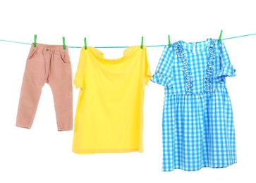 Photo of Clothes on laundry line against white background