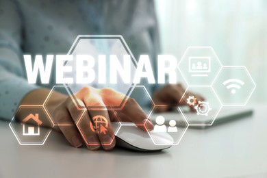 Image of Webinar, scheme with icons. Woman using laptop at table, closeup