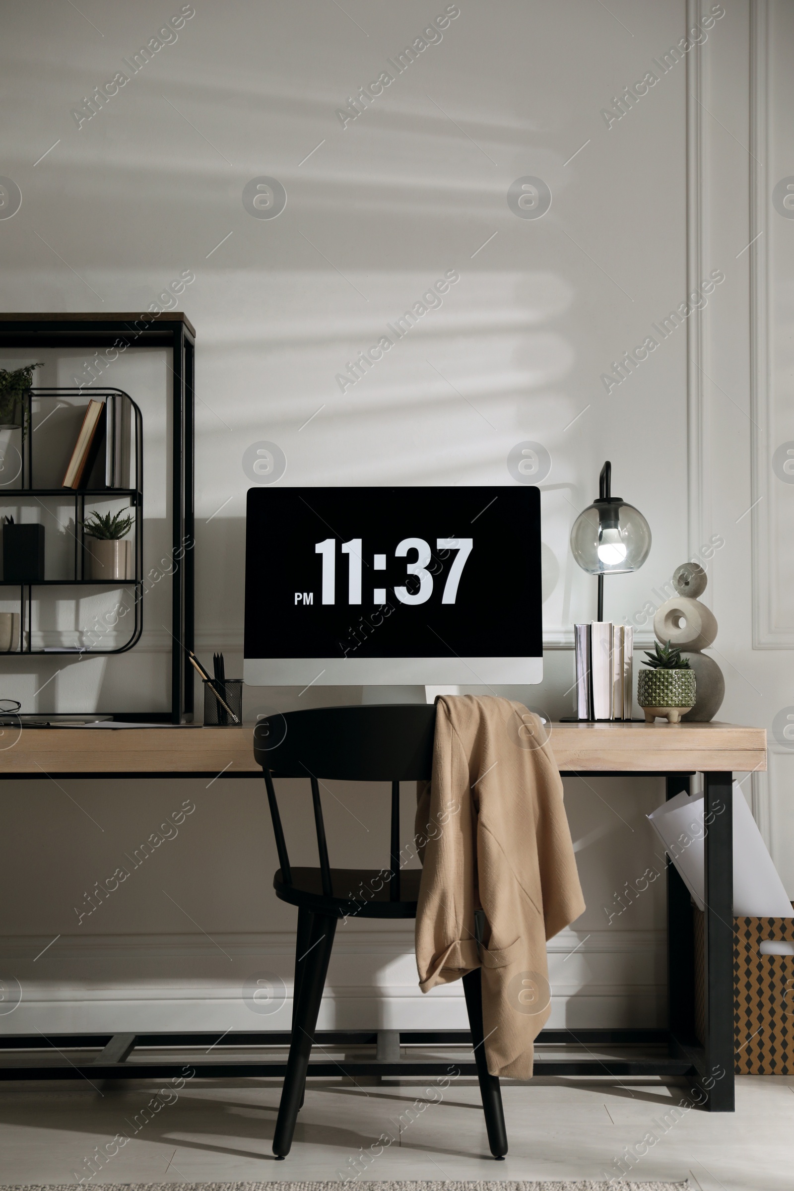 Photo of Room interior with comfortable workplace. Modern computer on wooden desk