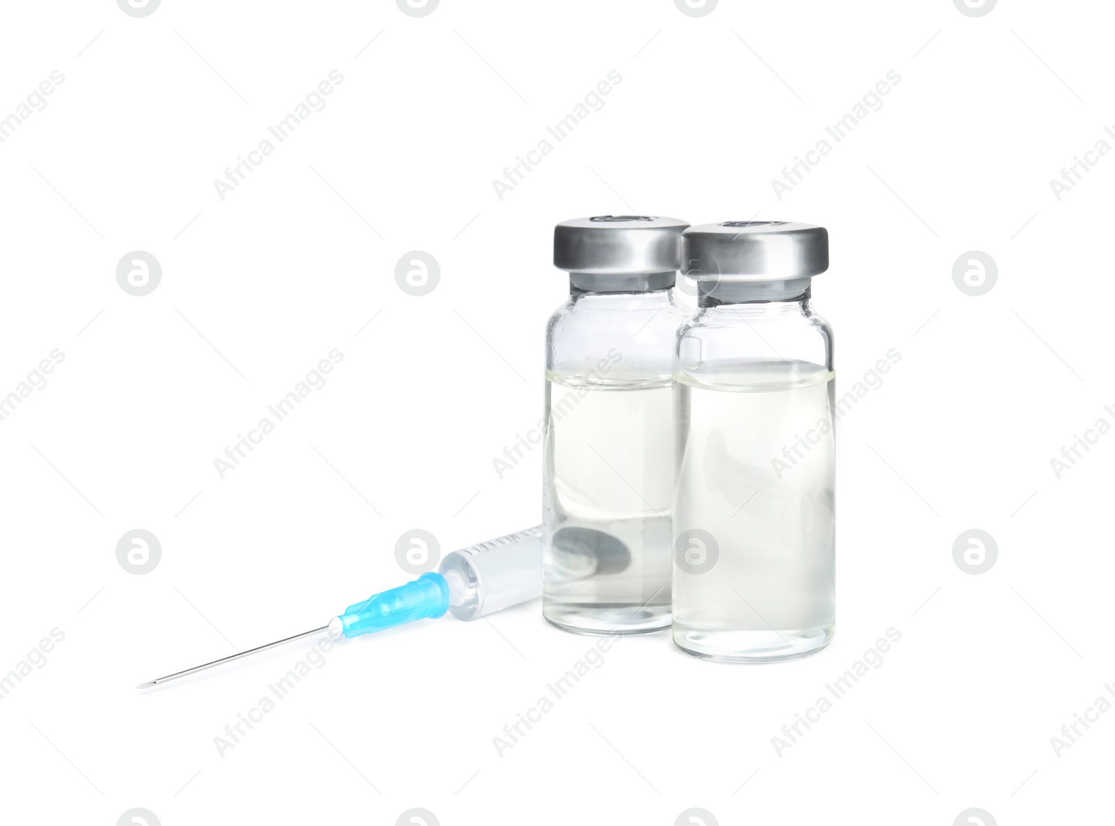 Photo of Vials and syringe on white background. Vaccination and immunization