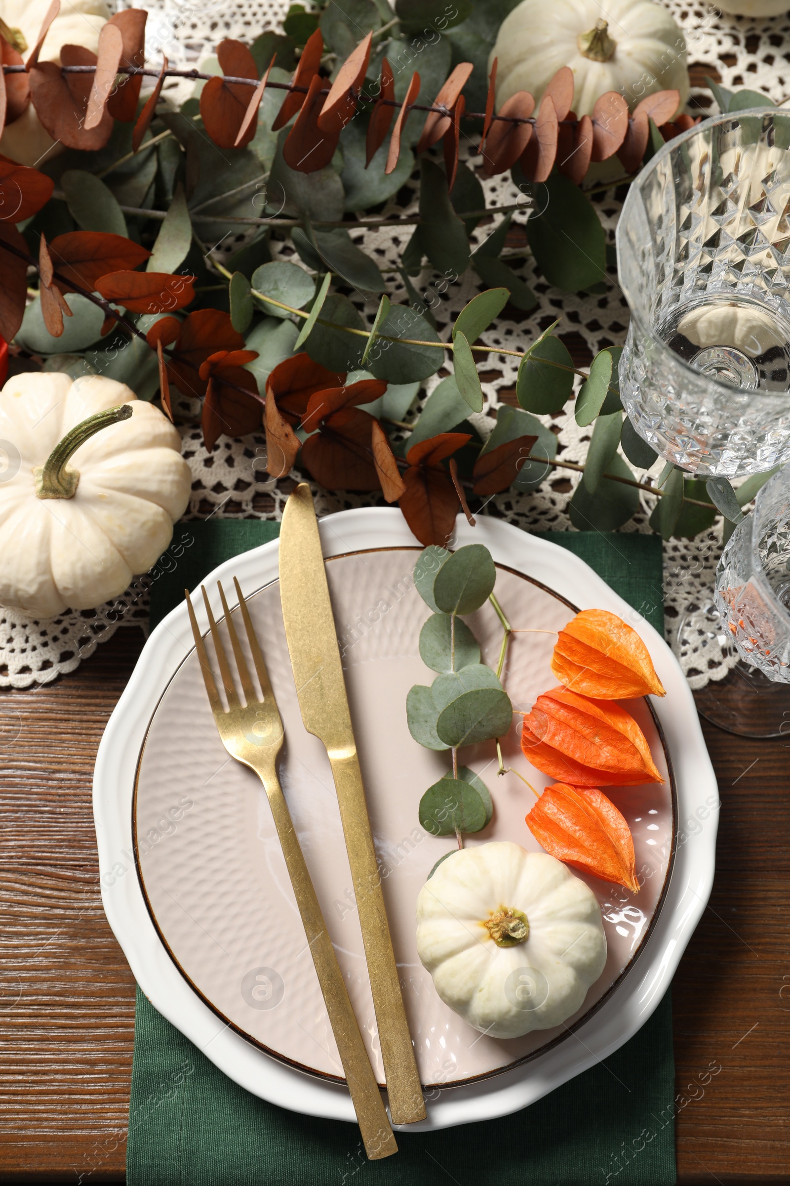 Photo of Beautiful autumn table setting. Plates, cutlery, glasses and floral decor, flat lay