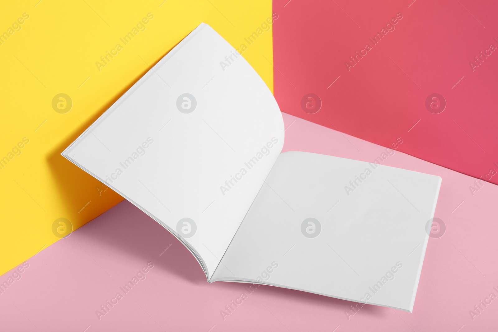 Photo of Empty book pages on color background. Mockup for design