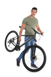 Handsome young man with modern bicycle on white background