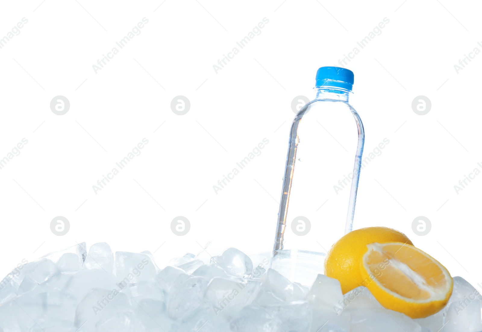 Photo of Bottle of water and lemons on ice cubes against white background