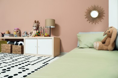 Montessori bedroom interior with floor bed and toys