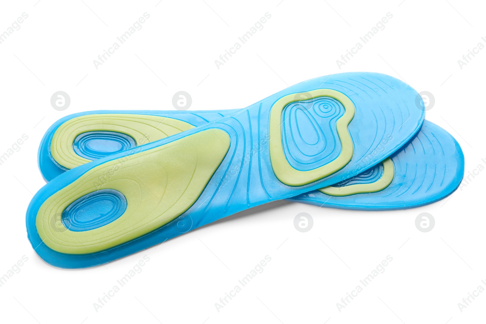 Photo of Light blue orthopedic insoles isolated on white