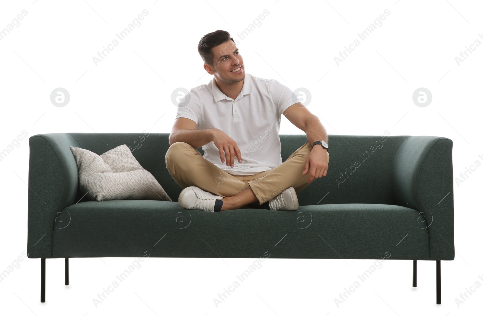 Photo of Man relaxing on comfortable green sofa against white background