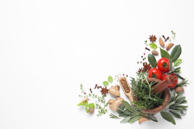 Different fresh herbs and spices on white background, top view