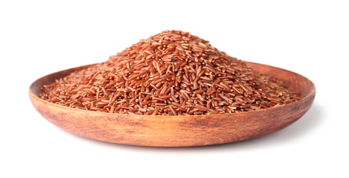 Plate with uncooked brown rice on white background