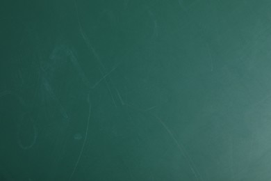 Photo of Texture of scratched green surface as background, closeup