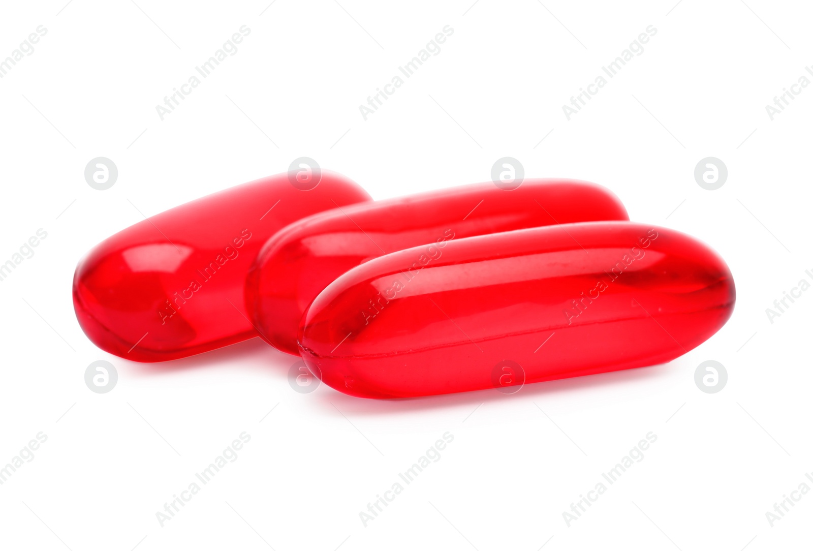 Photo of Pile of color pills on white background