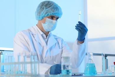 Photo of Scientist working with sample in laboratory. Medical research