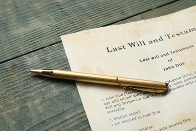 Last Will and Testament and pen on rustic wooden table, closeup