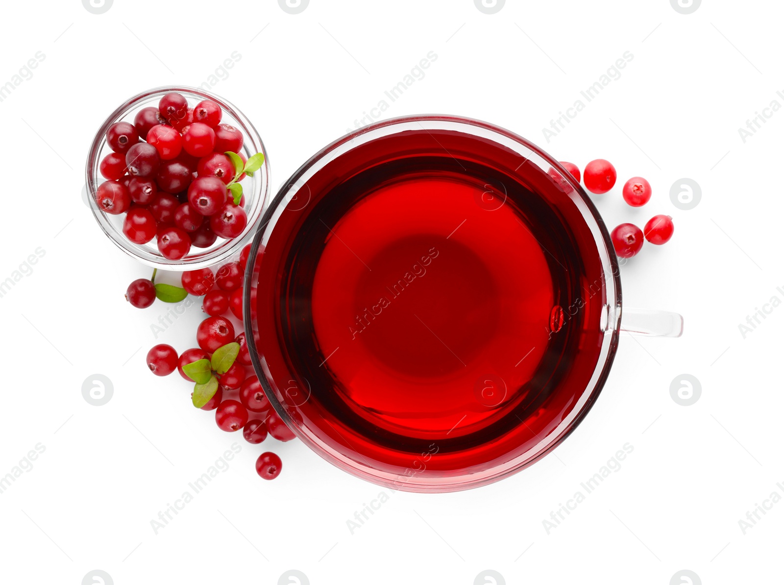 Photo of Cup of delicious cranberry tea and berries isolated on white, top view