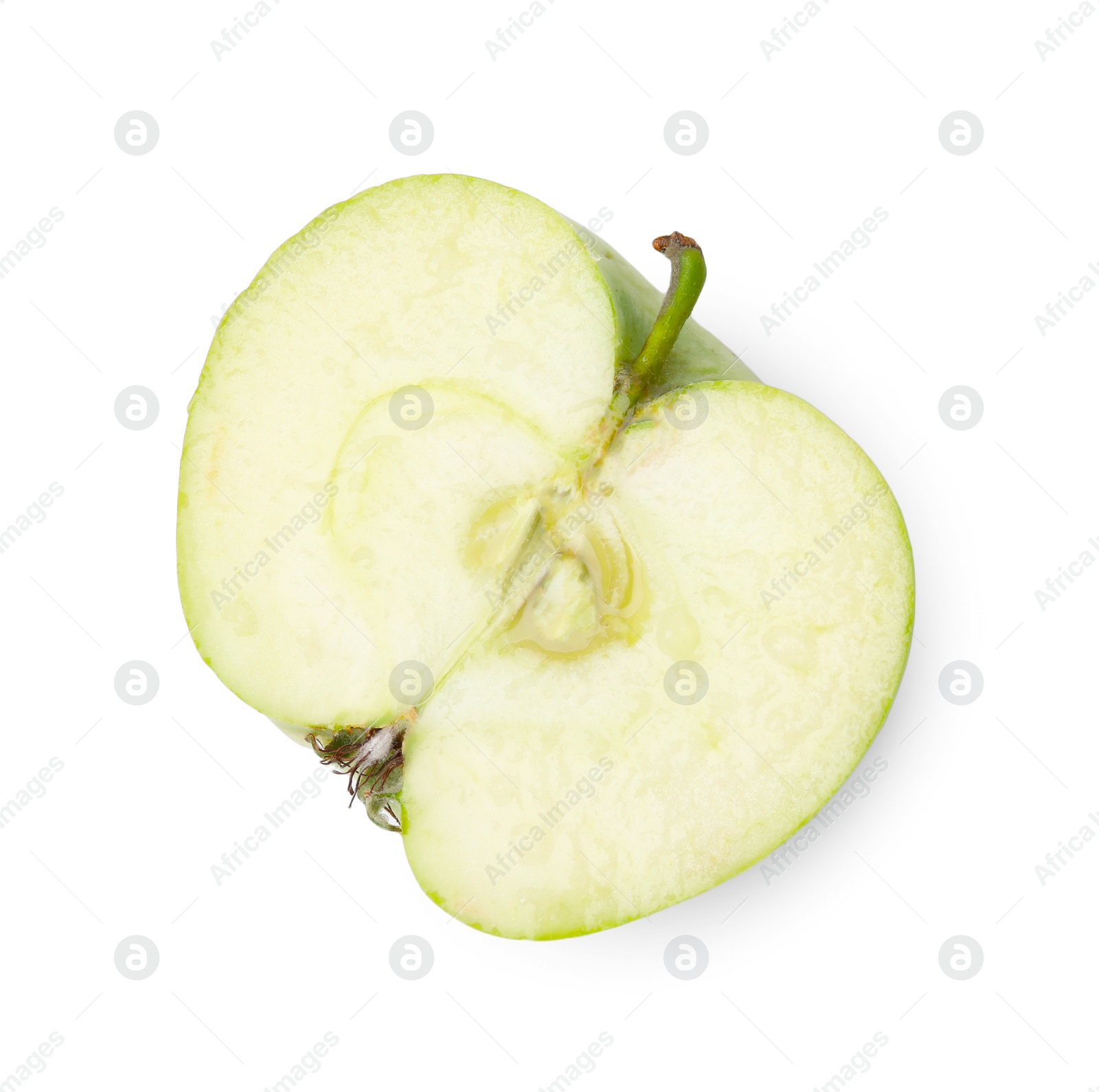 Photo of Half of ripe green apple on white background, top view