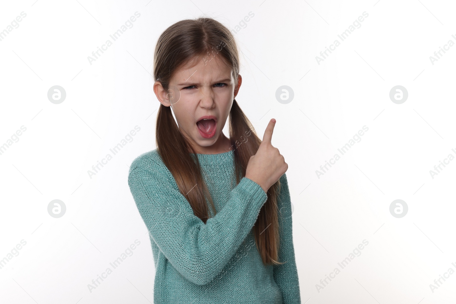 Photo of Surprised girl pointing at something on white background